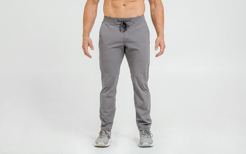 Front view of model wearing the cool gray REP Felix Pants.