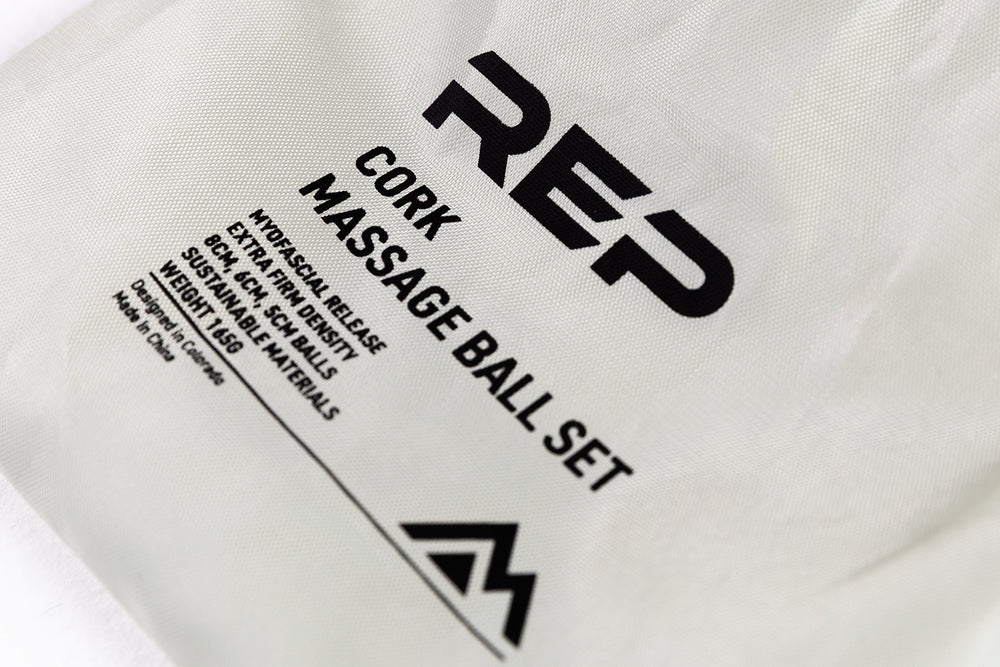 Close-Up: REP Cork Massage Ball Set product details printed on the drawstring carrying bag.