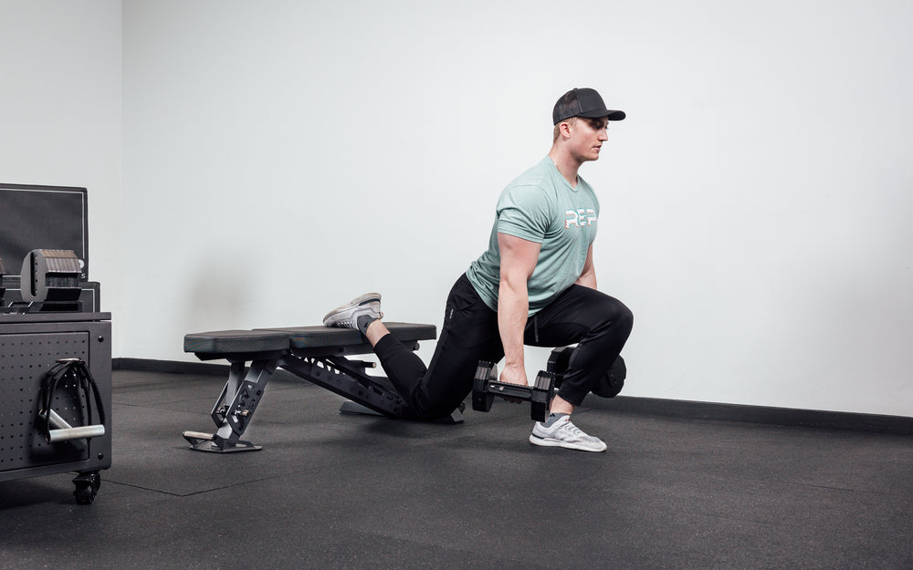 Joe doing bulgarian split squats on bench