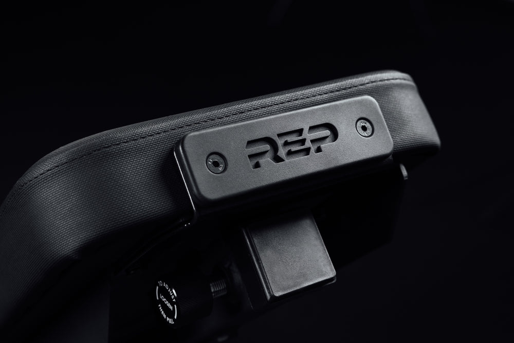 Rep on the end of the bench where leg roller is attached