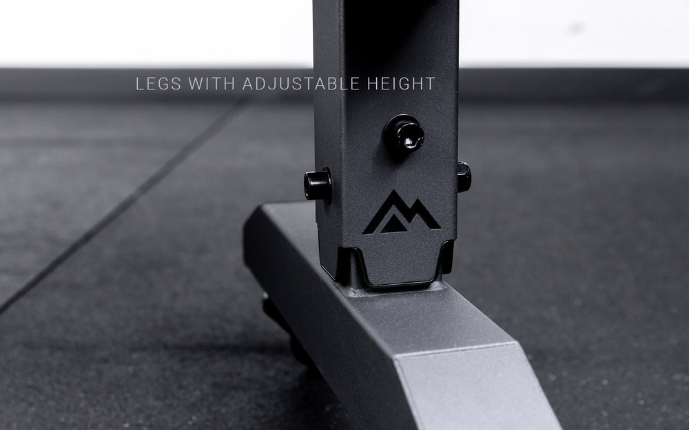 Legs featuring a laser cut mountain logo on the matte black REP® Adjustable Dumbbell Stand. Text says "Legs with adjustable height"