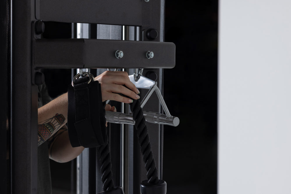 Triangle Row Cable Attachment Shown Hanging From Functional Trainer Storage