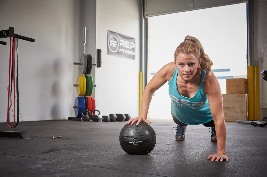 Woman working out with a weighted ball
