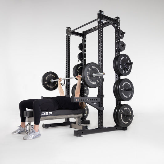 Athlete lifts on a half rack.