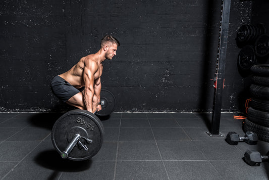 Man performing a barbell romanian deadlift