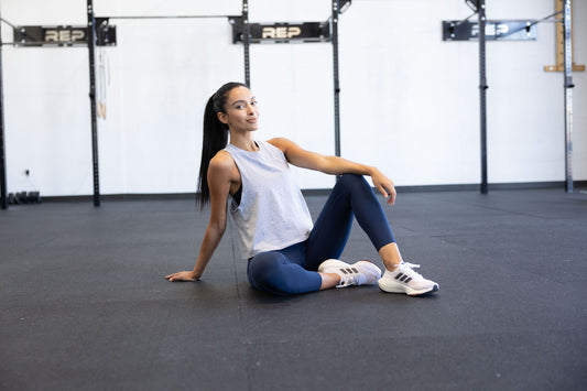 Woman doing a cooldown after lifting