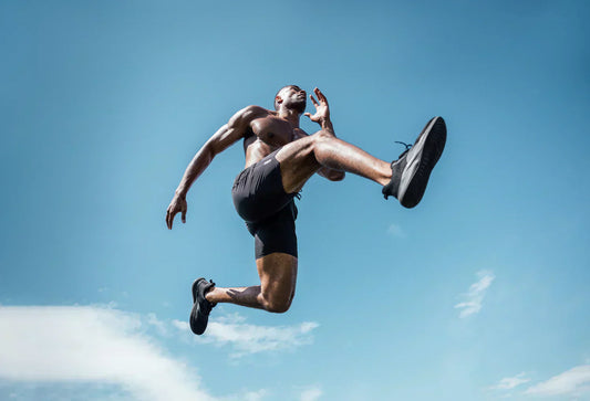 Athlete leaps up into the sky.