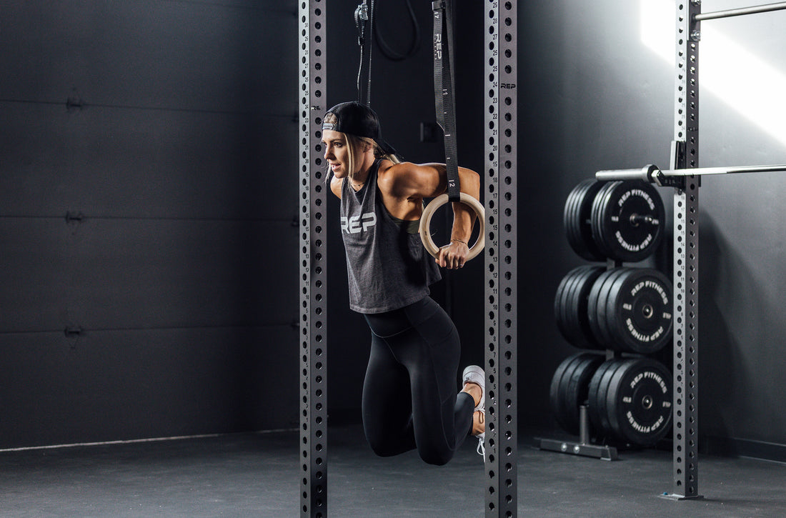 Claire P. Thompas working out on gymnastic rings