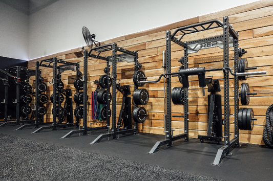 A commercial gym with power racks