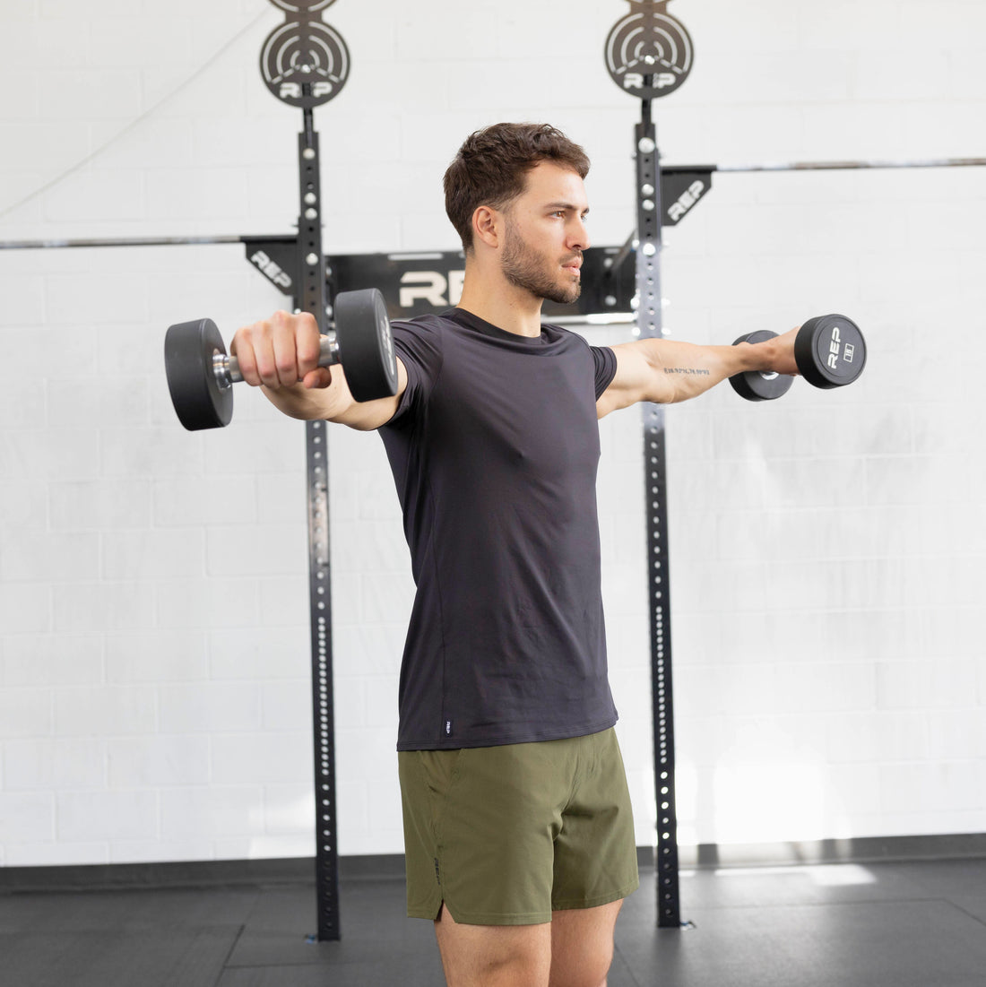 Man doing dumbbell lateral raises