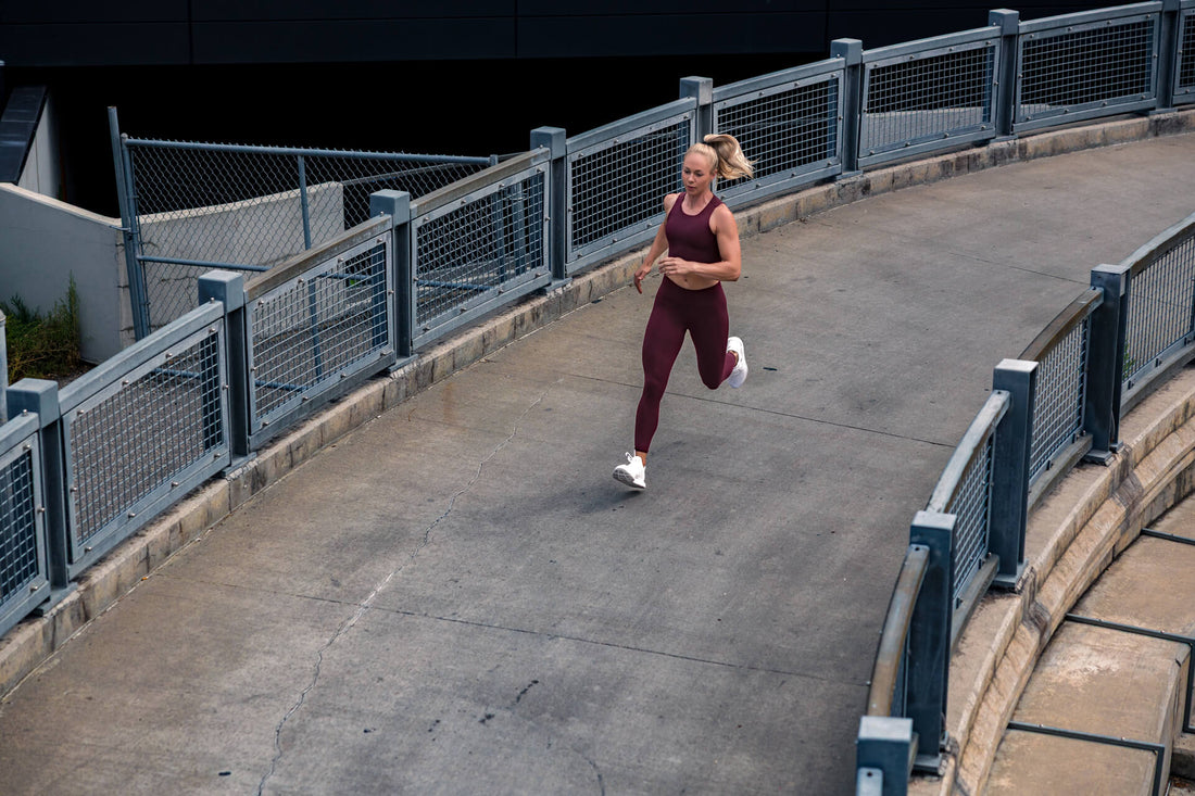 Athlete runs in REP apparel.