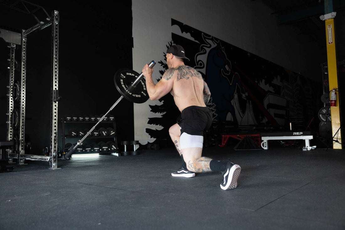 Man lifting with a landmine attachment