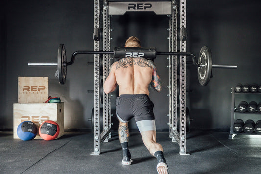 Athlete does a lunge with REP equipment.
