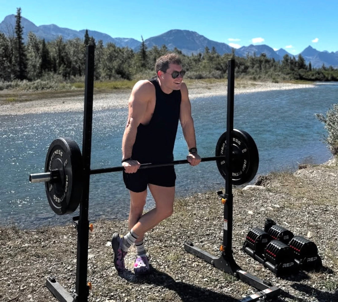 James Jackson works out with REP equipment beside a river.