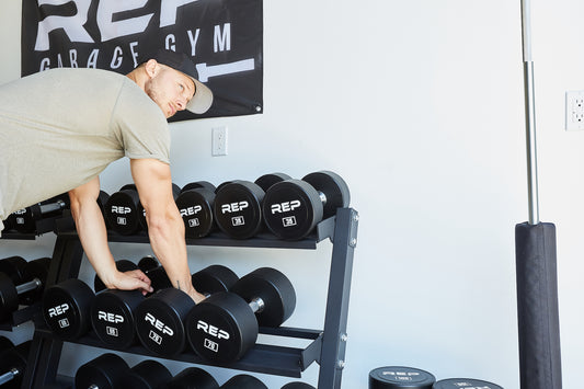 Man putting away dumbbells