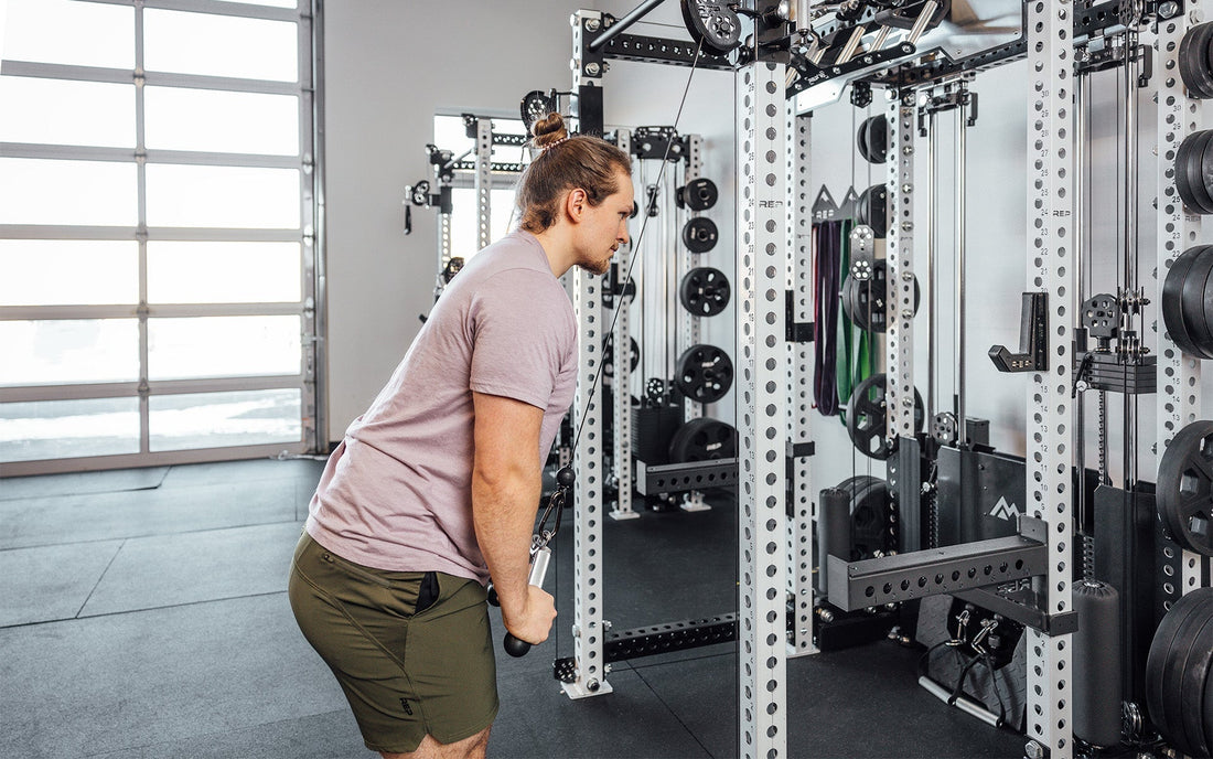 Woman doing tricep pushdowns