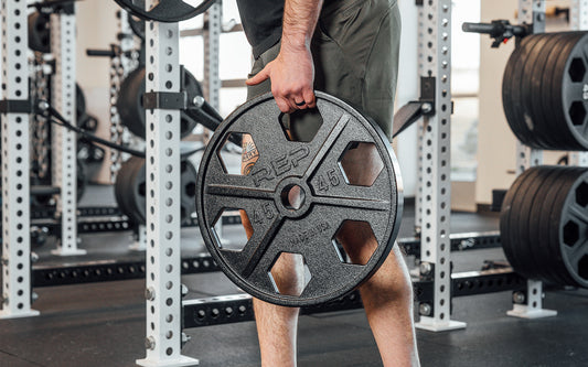 Lifter holding a weight plate