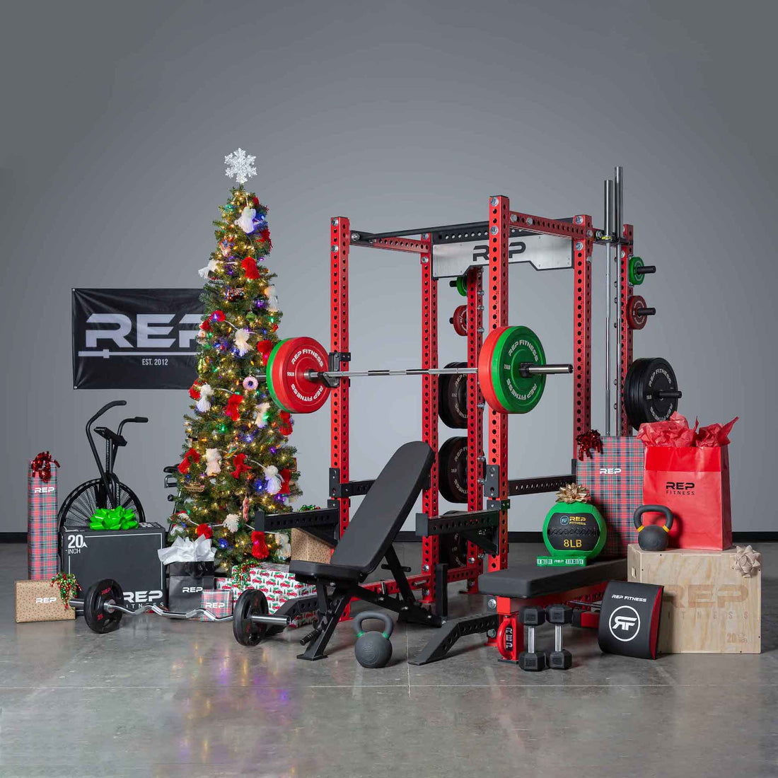 A home gym and gym equipment by a Christmas tree