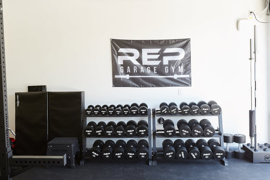 Woman lifting weights in a home gym