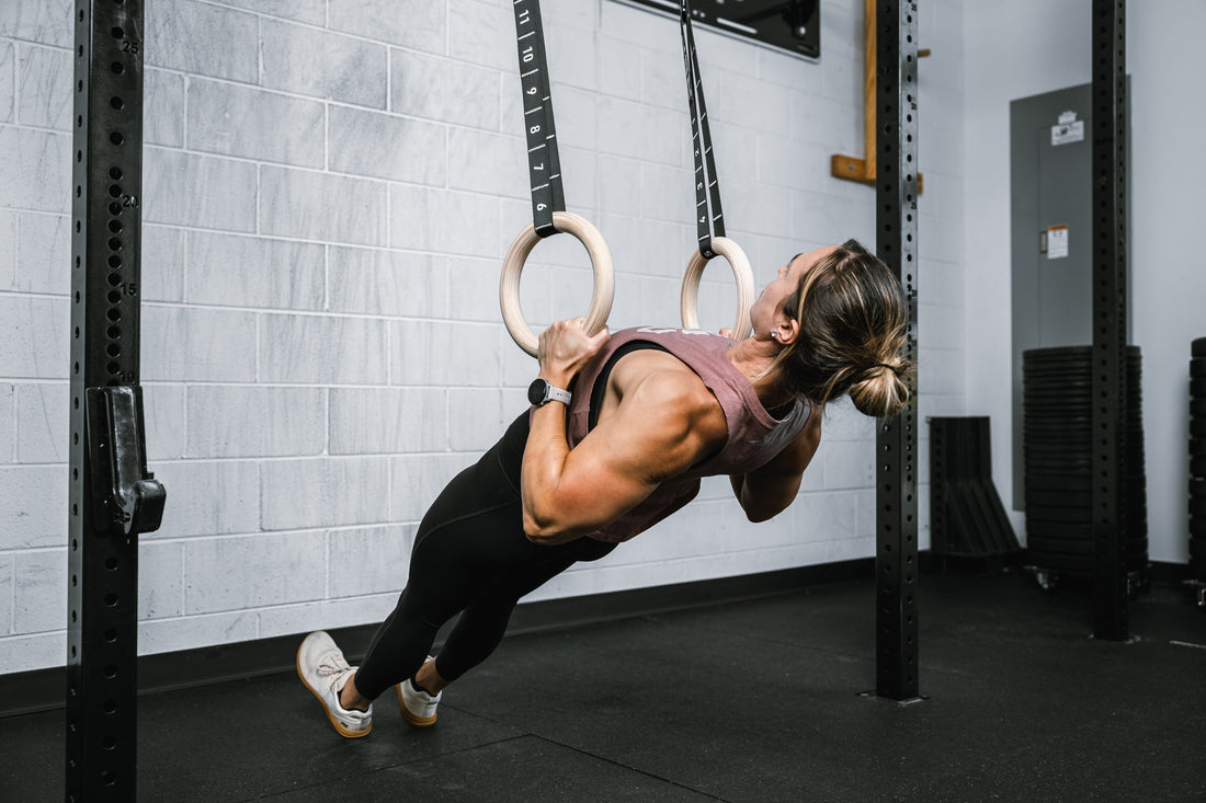 Athlete does back work on REP gymnastic rings.