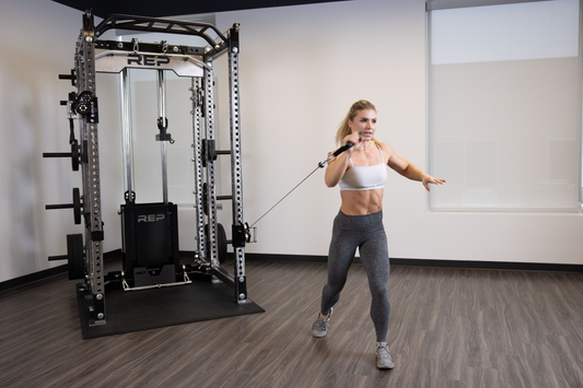 Woman lifting on cable machine