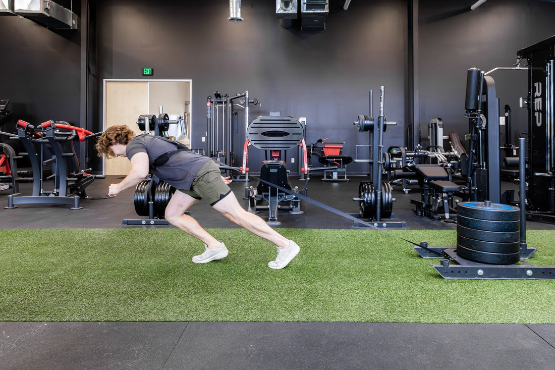 Athlete pulls a REP® Sled.