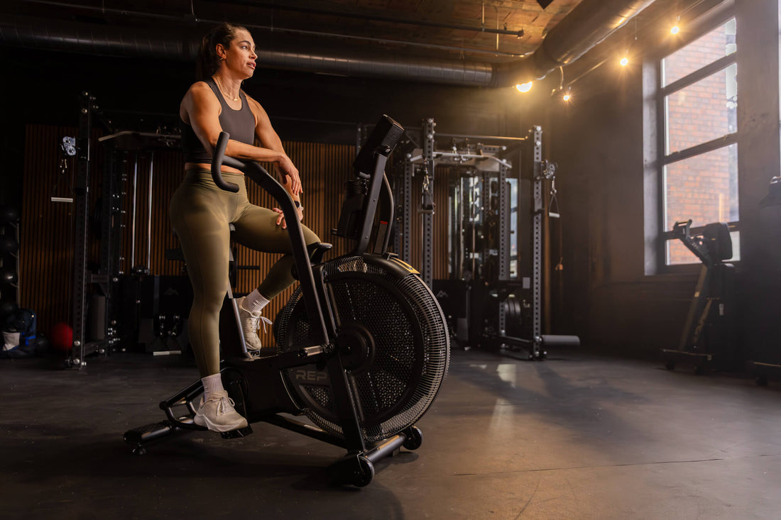 Athlete rests after a Strive™ Air Bike workout.