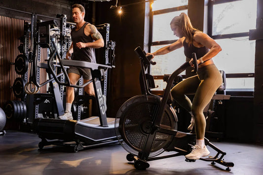 Athletes work on the Strive™ lineup of cardio equipment.