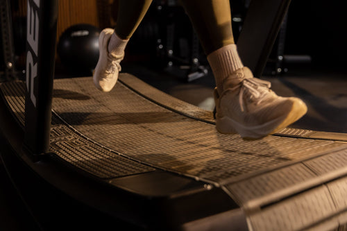 Shoes run on the Strive™ Curved Treadmill.