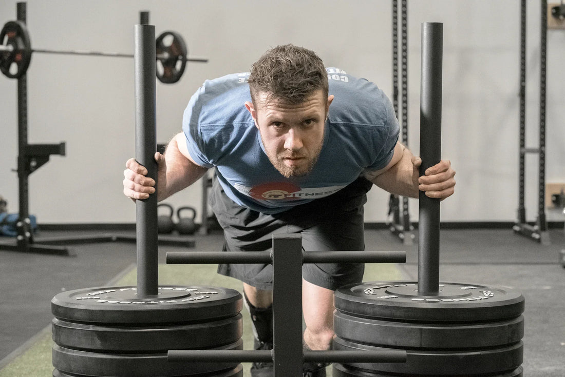 Athlete pushes a REP® sled.