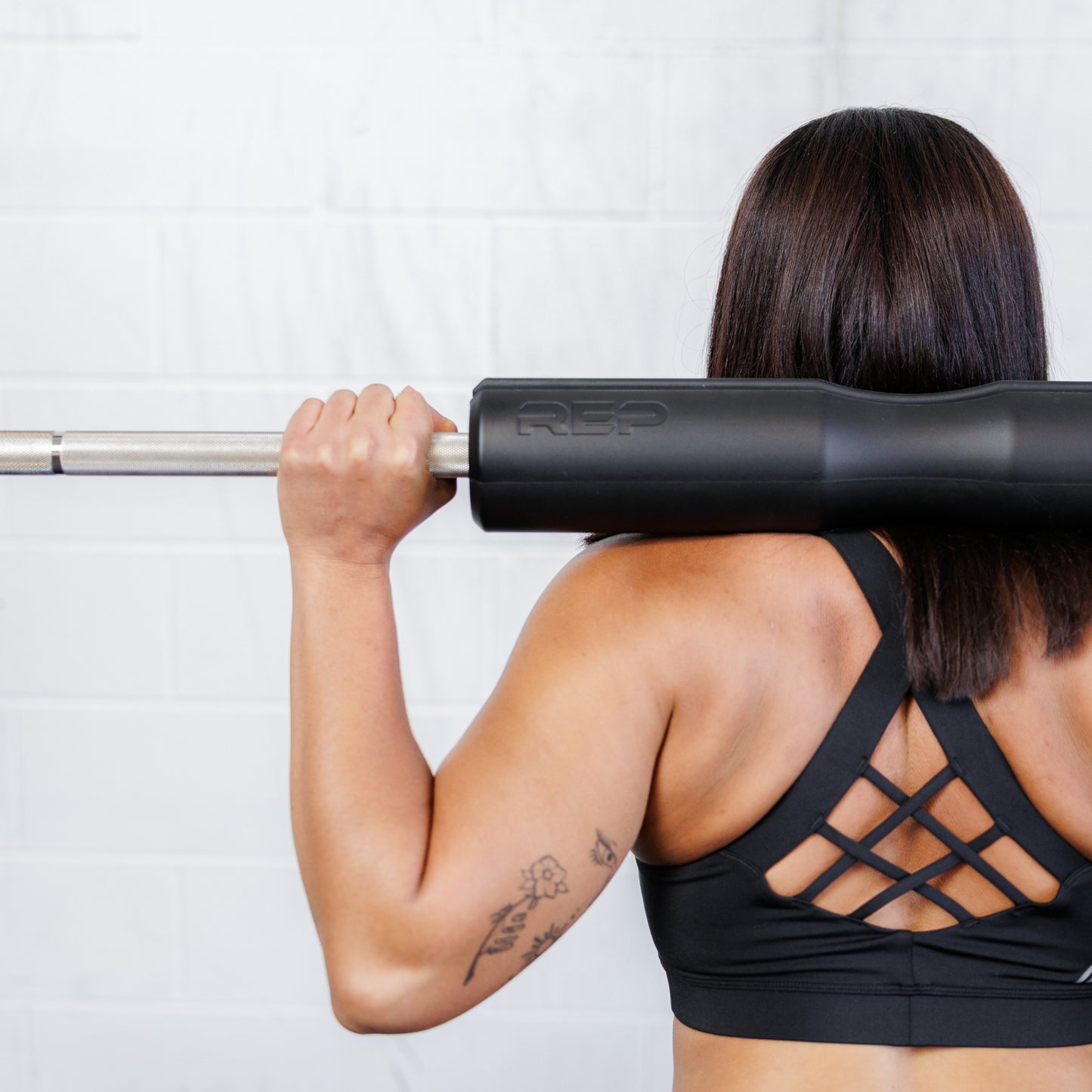 Athlete using the REP Fitness Hip Thrust pad