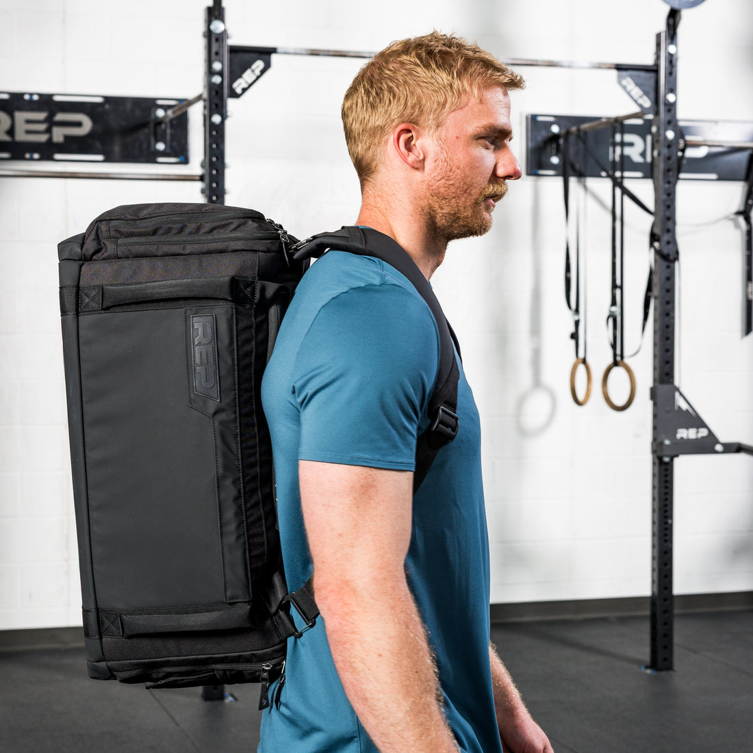 Athlete weatring the REP Fitness Slate Duffel Bag in Black