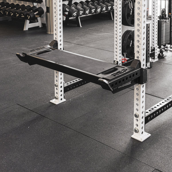 The REP Fitness Utility Bench installed on the standard length Spotter Arms 2.0