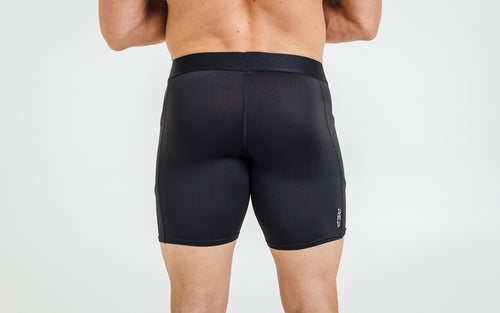 Rear view of model wearing the REP Virtus Light Compression Shorts.