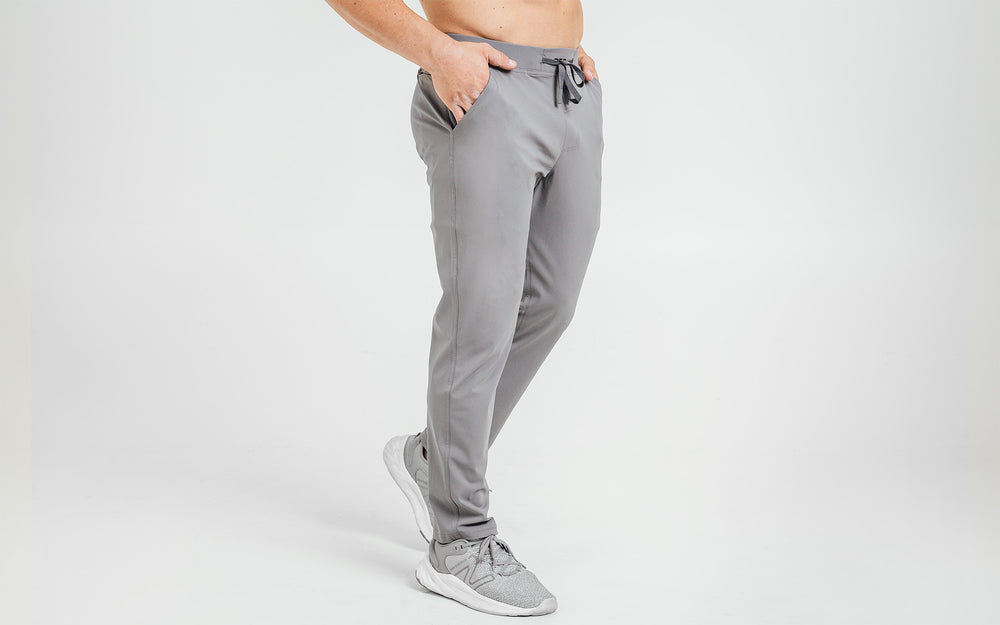 Side view of model wearing the cool gray REP Felix Pants.