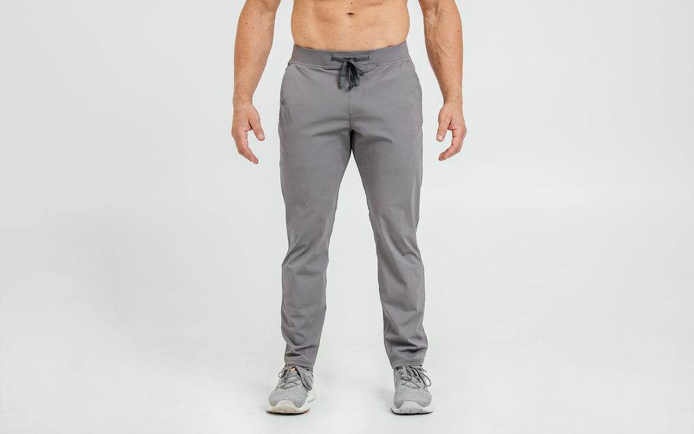 Front view of model wearing the cool gray REP Felix Pants.