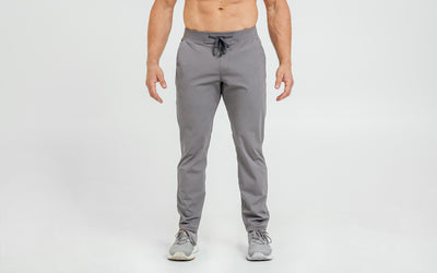 Front view of model wearing the cool gray REP Felix Pants