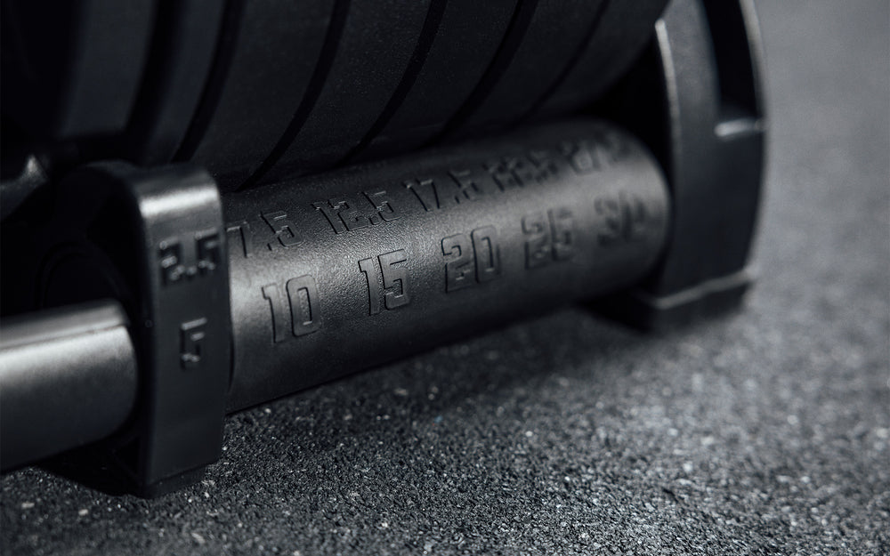 Close-up view of the weight markers on the cradle of the REP Fitness QuickDraw Adjustable Dumbbell (KG).