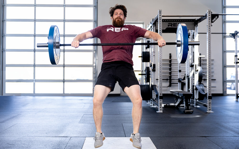 Person lifting using the Colorado Short Bar