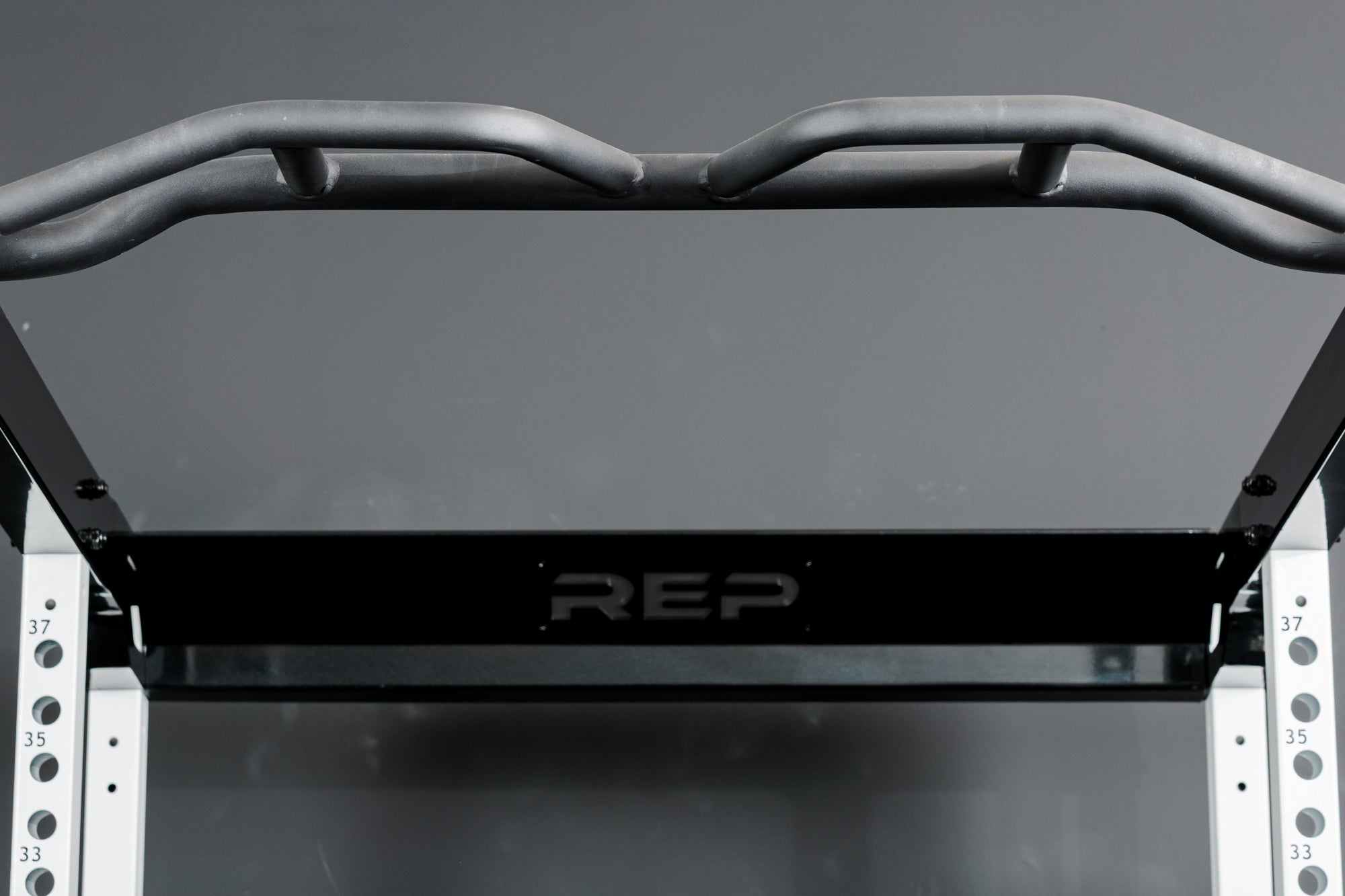The Multi-Grip Pull-Up Bar on the REP Fitness Altitude™ Power Rack