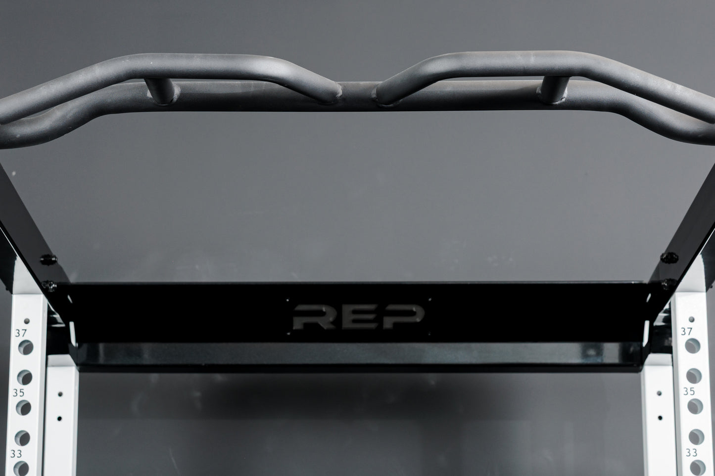 The Multi-Grip Pull-Up Bar on the REP Fitness Altitude™ Power Rack