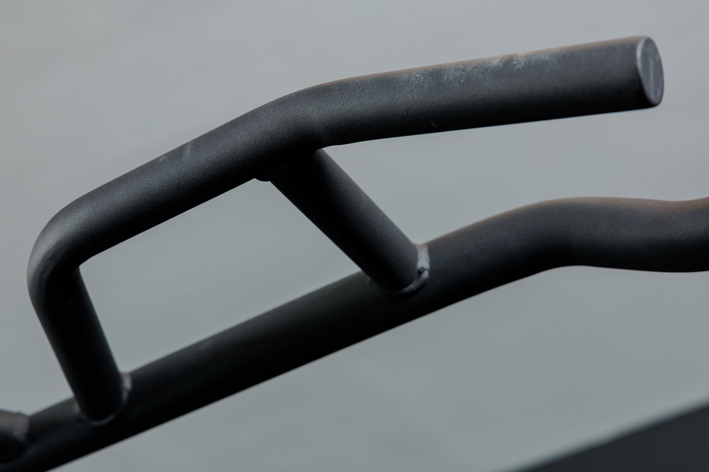 Close-up shot of the Multi-Grip Pull-Up Bar on the REP Fitness Altitude™ Power Rack