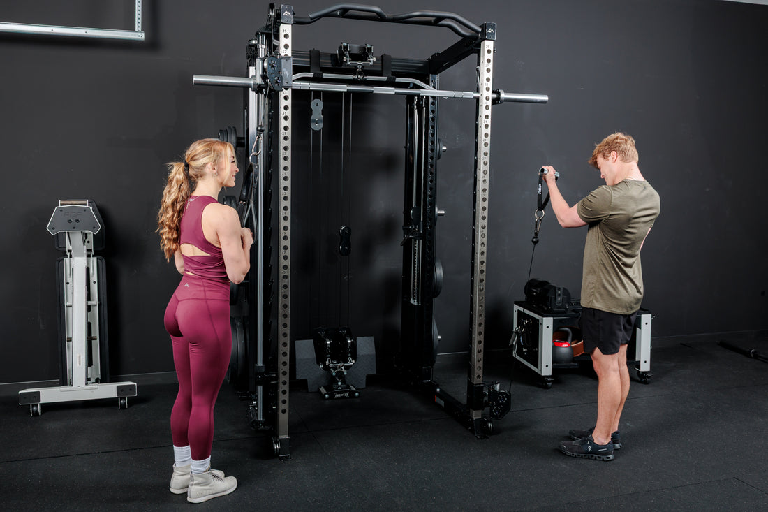 Two athletes using the REP Fitness Altitude™ Power Rack with Cable Machine Attachment at the same time