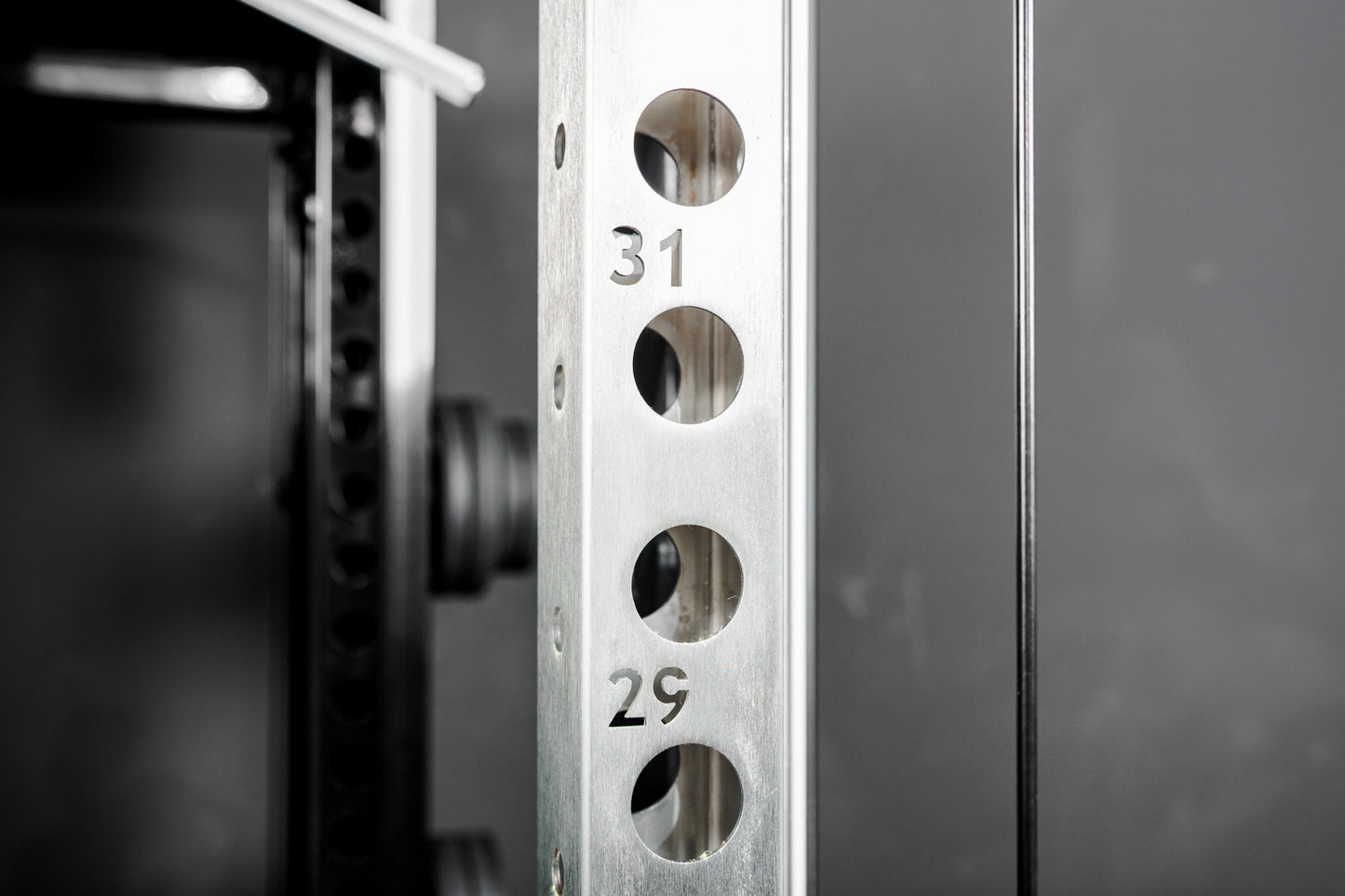 Close-up shot of the numbered rack uprights on the REP Fitness Altitude™ Power Rack