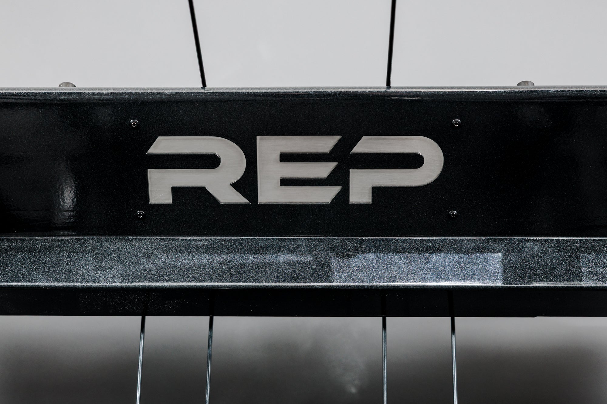 Shot of the REP Fitness Altitude™ Power Rack Logo Plate Crossmember