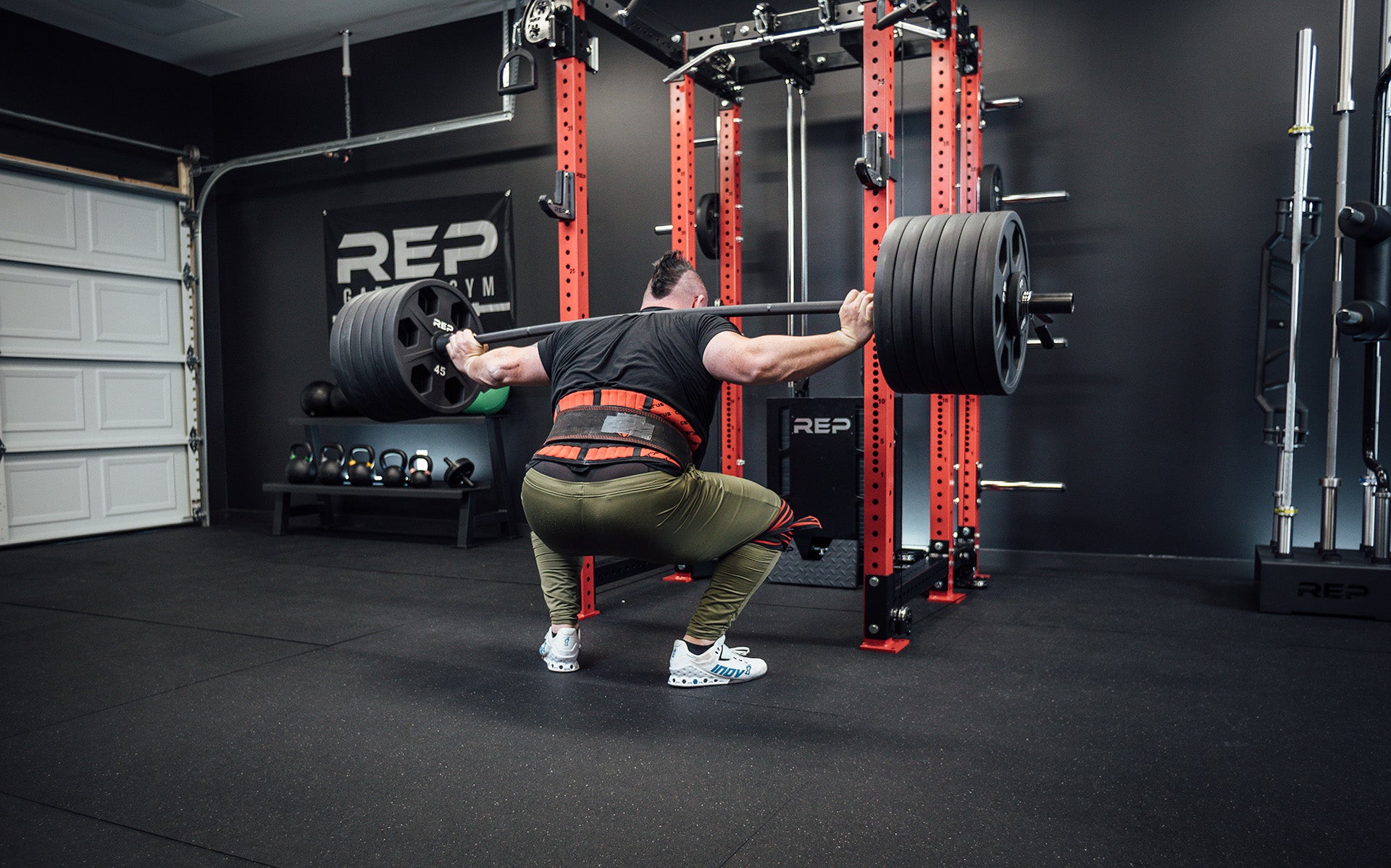 Rob Kearney back squatting 585lbs with the REP Helios Squat Bar.
