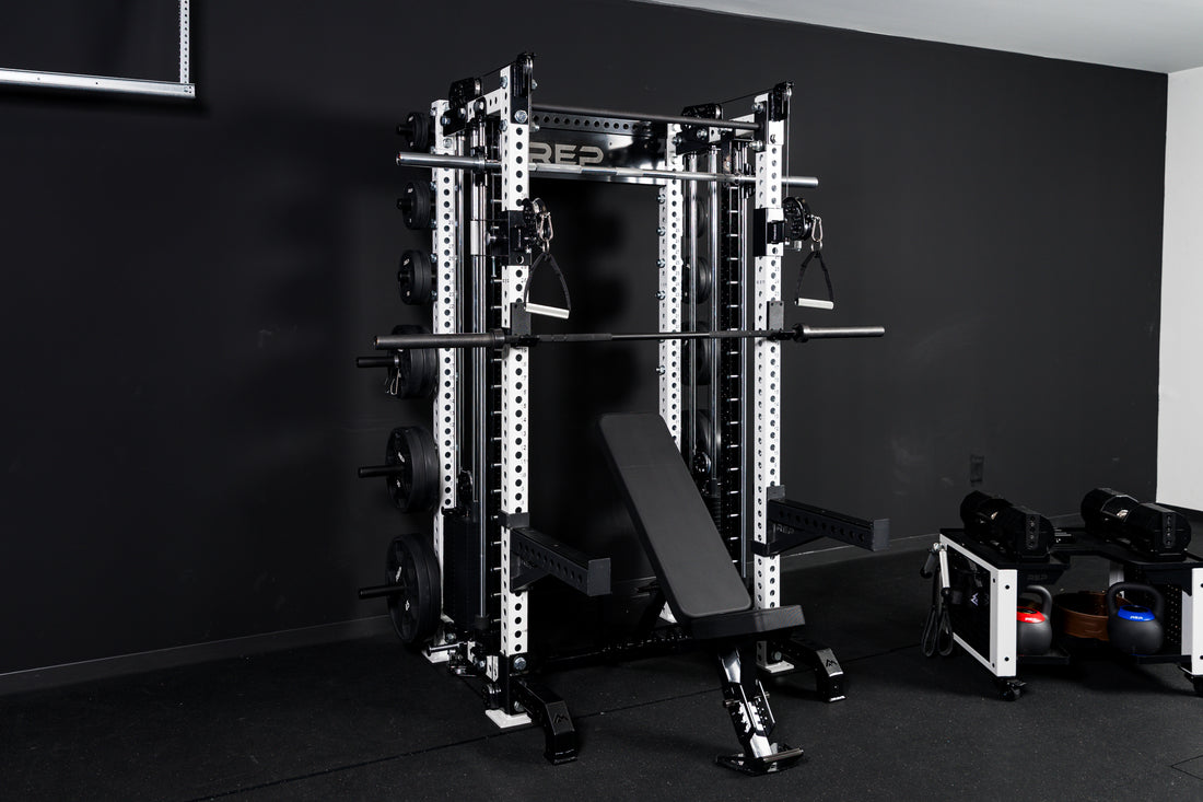 Summit™ All-In-One Athena™ Upgrade Kit showing the full setup of Summit™ All-In-One Athena™ with full gym setup with a bench, weights, a barbell, and dumbbell