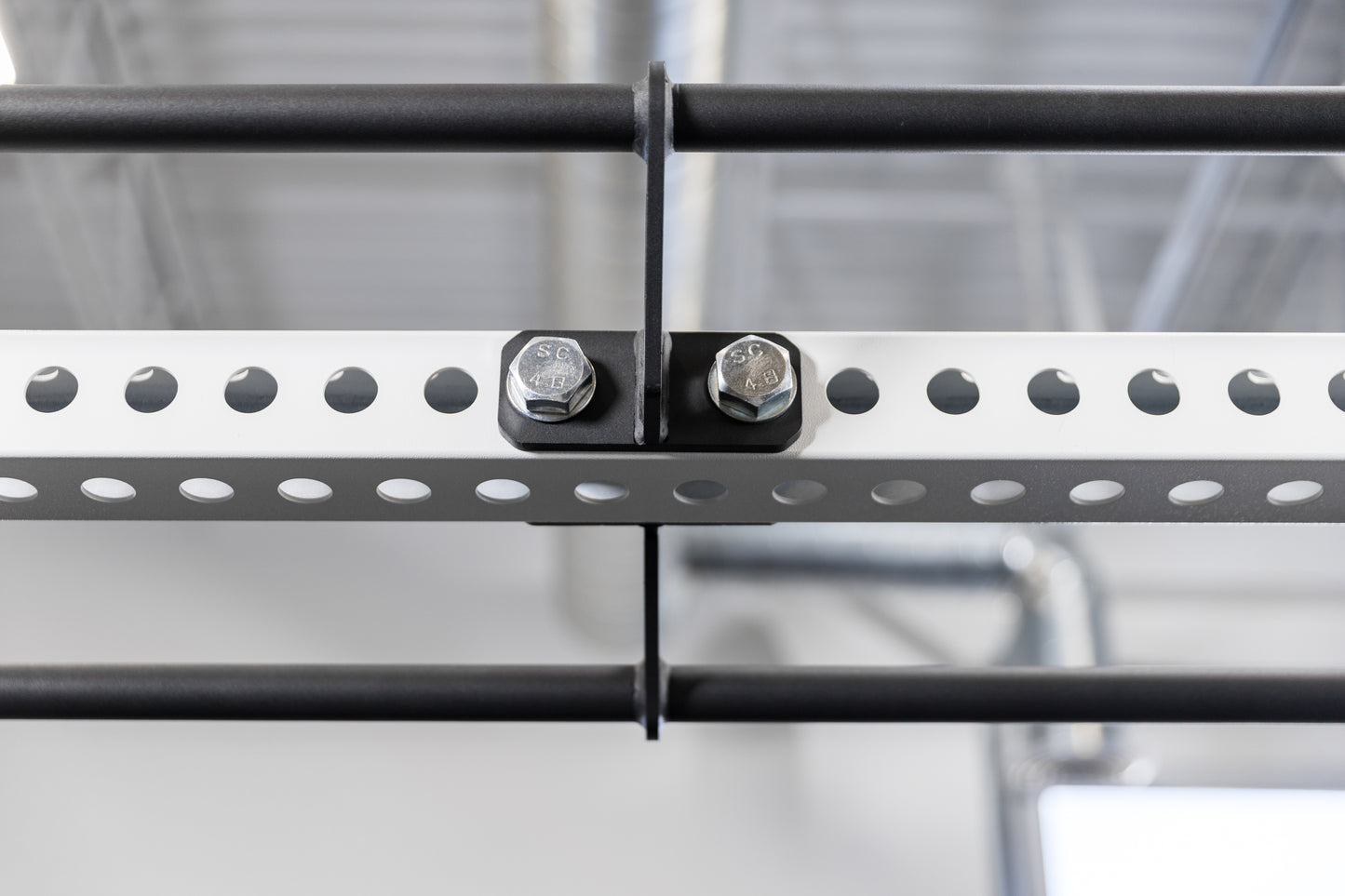 The REP Fitness Rack Crossmember Connectors with pull-up bars installed