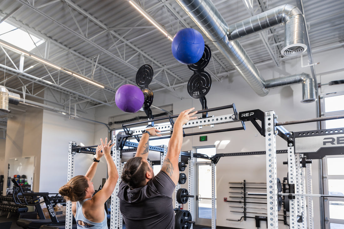 The REP Fitness Rack Crossmember Connectors with two wall ball targets installed