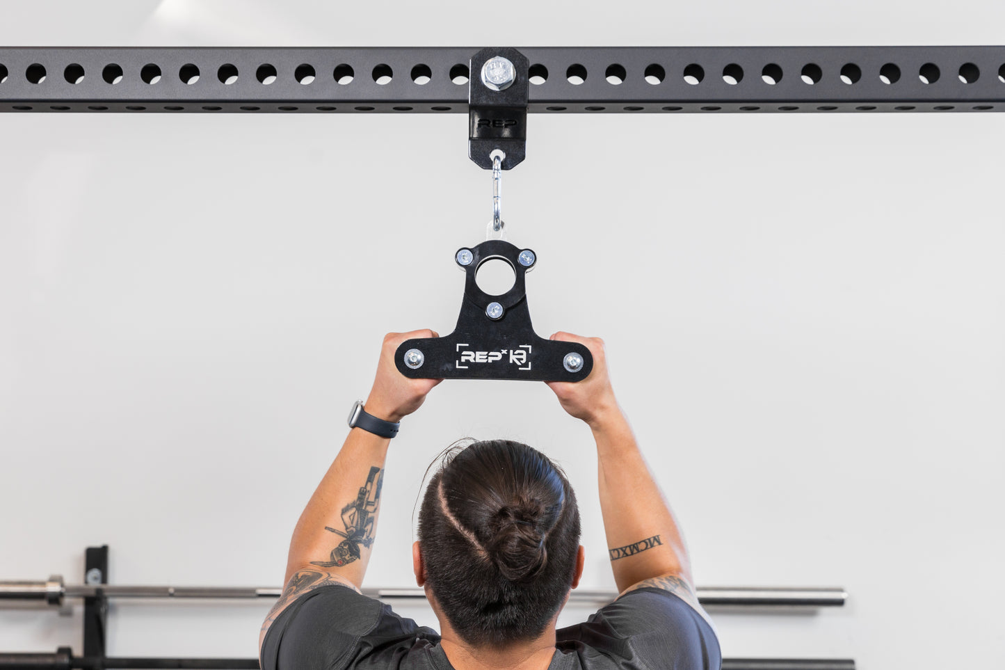 The REP Fitness Rack Crossmember Connectors with a shackle and close grip attachment installed